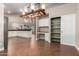 Open dining area with white cabinets, a built-in desk, and tile flooring at 2633 E Amber Ridge Way, Phoenix, AZ 85048