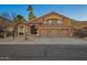 Charming two-story home with desert landscaping, a three-car garage, and a tile roof at 2633 E Amber Ridge Way, Phoenix, AZ 85048