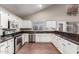 Well-lit kitchen featuring white cabinets, stainless steel appliances, and granite countertops at 2633 E Amber Ridge Way, Phoenix, AZ 85048