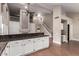 Open-concept living room with fireplace, vaulted ceilings, and staircase at 2633 E Amber Ridge Way, Phoenix, AZ 85048