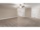 Spacious living room with neutral walls and carpet looking out at the staircase at 2633 E Amber Ridge Way, Phoenix, AZ 85048