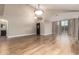 Spacious living room featuring hardwood floors, neutral walls, and ample natural light at 2633 E Amber Ridge Way, Phoenix, AZ 85048