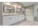 Bathroom with double sinks, bathtub, and tiled shower with glass door at 2633 E Amber Ridge Way, Phoenix, AZ 85048