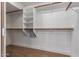 Walk-in closet with shelves and hanging rods, offering ample storage at 2633 E Amber Ridge Way, Phoenix, AZ 85048