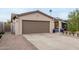 Exterior shot of a home's attached two-car garage and driveway at 2744 E Windrose Dr, Phoenix, AZ 85032