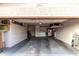 Spacious garage with overhead storage and shelving along the walls, plus a door to the house at 2744 E Windrose Dr, Phoenix, AZ 85032