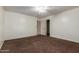 This bedroom offers neutral walls, plush carpeting, and a ceiling fan at 3127 W Apollo Rd, Phoenix, AZ 85041