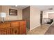 Bonus room featuring tile floors, plush carpet, with railing and decorative furniture at 3127 W Apollo Rd, Phoenix, AZ 85041