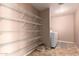 The laundry room features ample shelving space and modern appliances at 3127 W Apollo Rd, Phoenix, AZ 85041