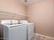 This dedicated laundry area features modern appliances at 3127 W Apollo Rd, Phoenix, AZ 85041