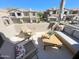 Relaxing outdoor balcony featuring comfortable seating and community views at 3131 E Legacy Dr # 2105, Phoenix, AZ 85042