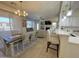 Inviting dining area with a modern chandelier, open to the living room and kitchen, perfect for gatherings at 3131 E Legacy Dr # 2105, Phoenix, AZ 85042