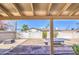 Backyard with a concrete patio, block wall, and a ping pong table at 3210 W Belmont Ave, Phoenix, AZ 85051