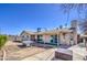 Wide view of backyard with ping pong table and covered patio at 3210 W Belmont Ave, Phoenix, AZ 85051