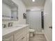 Bathroom featuring a vanity with solid surface countertop and shower with a patterned curtain at 3210 W Belmont Ave, Phoenix, AZ 85051