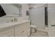 Bathroom featuring a vanity with solid surface countertop and shower with a patterned curtain at 3210 W Belmont Ave, Phoenix, AZ 85051