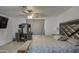 Spacious bedroom showcasing a decorative headboard, ceiling fan, and a gray vanity with a mirror at 3210 W Belmont Ave, Phoenix, AZ 85051