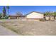 Street view of a single-Gathering home featuring a large front yard and a long driveway at 3210 W Belmont Ave, Phoenix, AZ 85051