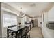 Open kitchen with stainless steel appliances, white cabinets and a gray tiled backsplash at 3210 W Belmont Ave, Phoenix, AZ 85051