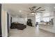 Open-concept living area featuring tile floors, modern ceiling fans, and large sectional at 3210 W Belmont Ave, Phoenix, AZ 85051