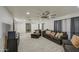 Spacious living room features tile floors, recessed lighting, and modern ceiling fan at 3210 W Belmont Ave, Phoenix, AZ 85051