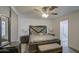 The main bedroom has a ceiling fan, tile floors and an ensuite bathroom at 3210 W Belmont Ave, Phoenix, AZ 85051