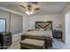 The main bedroom features a ceiling fan, a large window and tile flooring at 3210 W Belmont Ave, Phoenix, AZ 85051