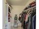 Well-organized walk-in closet with clothing racks and shelves filled with clothes and storage at 3210 W Belmont Ave, Phoenix, AZ 85051