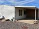 This exterior of home features covered patio and rock landscaping at 3330 E Main St # 323, Mesa, AZ 85213