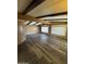 Spacious living room with wood floors, ceiling beams, and plenty of natural light at 3330 E Main St # 323, Mesa, AZ 85213