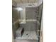 Modern tiled shower with glass door, bench, and rainfall shower head at 3330 E Main St # 323, Mesa, AZ 85213