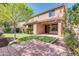 Charming backyard showcasing a patio, lush artificial turf, landscaping, and string lights for cozy outdoor living at 3443 S California St, Chandler, AZ 85248