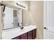 Bathroom with a large mirror above a white counter and dark wood cabinets at 3443 S California St, Chandler, AZ 85248