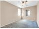 Neutral bedroom featuring a ceiling fan, carpeted floor, and two windows, creating a bright and inviting space at 3443 S California St, Chandler, AZ 85248