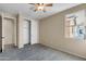 Bedroom with neutral walls and carpet, closet with sliding doors and a window at 3443 S California St, Chandler, AZ 85248