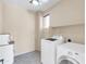 Bright laundry room featuring a washer and dryer, providing convenience and functionality at 3443 S California St, Chandler, AZ 85248