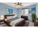 Main bedroom featuring carpet, a ceiling fan, and a window overlooking a private yard at 3443 S California St, Chandler, AZ 85248