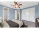 Main bedroom featuring carpet, closet with sliding doors, and a ceiling fan at 3443 S California St, Chandler, AZ 85248