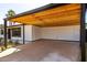 Large open carport with a wooden roof and sleek black support beams at 3707 E Amelia Ave, Phoenix, AZ 85018