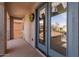 Covered balcony with double glass doors and a view of the neighborhood at 3891 E Melrose St, Gilbert, AZ 85297