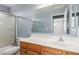 Bathroom featuring a vanity, mirror, shower stall, and toilet, all with blue walls at 3891 E Melrose St, Gilbert, AZ 85297