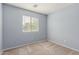 Neutral bedroom featuring carpet, light blue walls, and a window with blinds at 3891 E Melrose St, Gilbert, AZ 85297