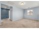 Spacious bonus room with plush carpeting and natural light from a large window at 3891 E Melrose St, Gilbert, AZ 85297