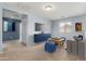 Bright bonus room featuring plush carpeting, a large window, and comfortable seating, perfect for relaxation at 3891 E Melrose St, Gilbert, AZ 85297