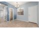 Dining area with chandelier, pantry, and window with blinds at 3891 E Melrose St, Gilbert, AZ 85297