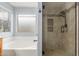 Bathroom with soaking tub and glass enclosed shower at 3891 E Melrose St, Gilbert, AZ 85297