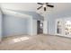 Primary bedroom featuring vaulted ceiling, balcony access, and neutral color scheme at 3891 E Melrose St, Gilbert, AZ 85297