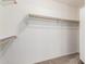 Walk-in closet with shelving and hanging racks for ample storage at 3891 E Melrose St, Gilbert, AZ 85297