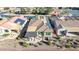 Aerial view of a single Gathering home featuring solar panels, outdoor living space, and a hot tub at 3942 N San Marin Dr, Florence, AZ 85132