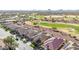 Aerial view of residential homes near a golf course, set against a mountain backdrop at 3942 N San Marin Dr, Florence, AZ 85132